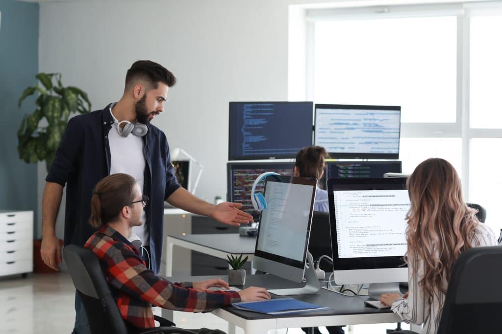 The Rise of Managed IT Support Post COVID 1 Team of programmers working in office