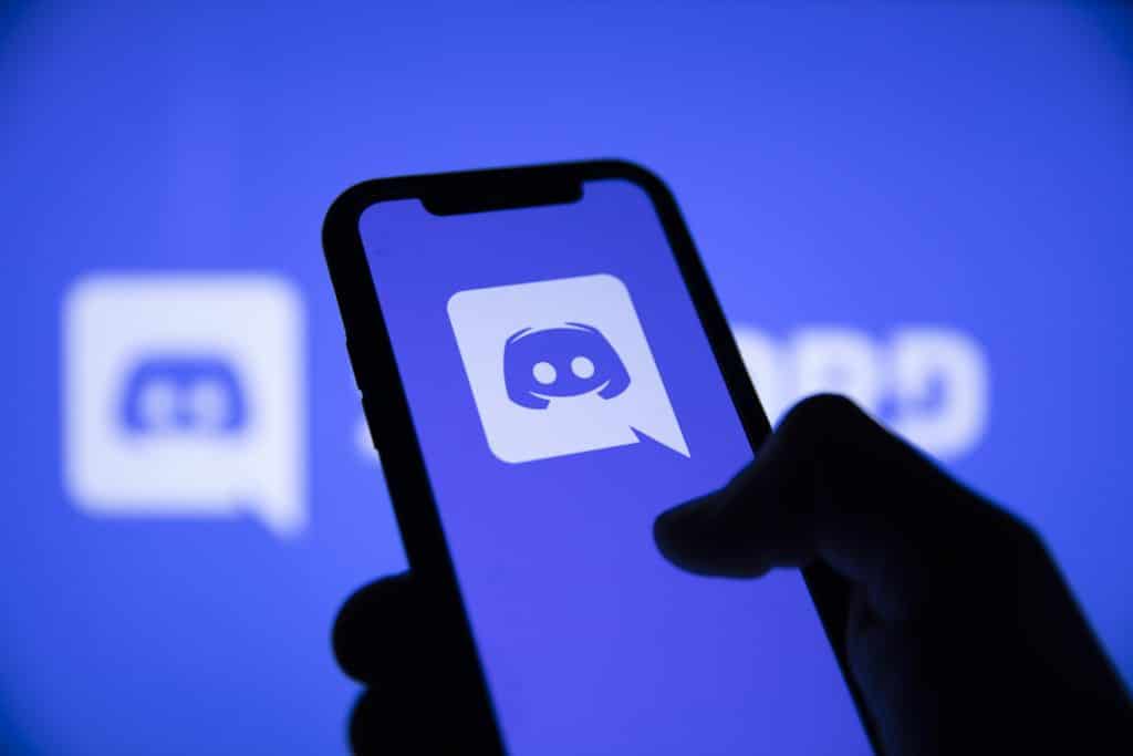 Tech Advancements Every Streamer Needs 3 LONDON, UK - May 2021: Discord social network logo on a smartphone.