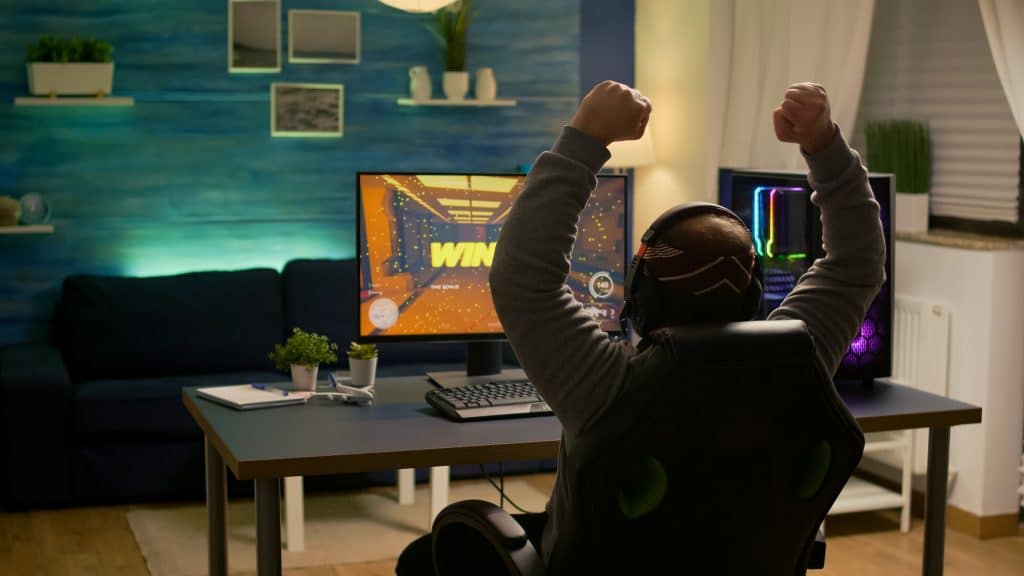 Is DDR5 RAM Worth It? All You Need To Know 3 Gamer winning hands in the air