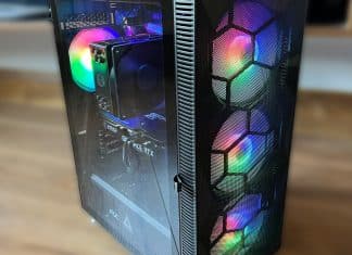 MONTECH X3 Mesh PC Case Review offset side view of MONTECH X3 Mesh pc case with rainbow lighted fans with a brown wood floor blurred background