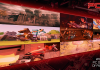 The 25 Best PC Games Of All Time A montage of nine classic PC game screenshots including Elden Ring, Minecraft, Baldur's Gate 3 and The Orange Box, displayed on a perspective-skewed screen with a red tint — cover art for PCZ's 25 Best PC Games of All Time feature
