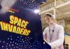 Amazing Games Exhibition, The World’s Largest, Opens In Scotland games exhibition girl plays retro arcade game Space Invaders