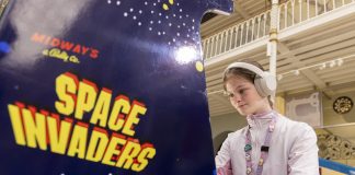 Amazing Games Exhibition, The World’s Largest, Opens In Scotland games exhibition girl plays retro arcade game Space Invaders