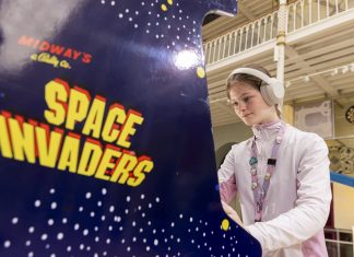 Amazing Games Exhibition, The World’s Largest, Opens In Scotland games exhibition girl plays retro arcade game Space Invaders