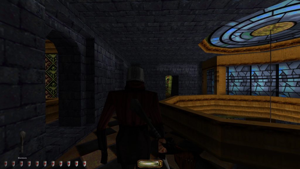 Thief: The Dark Project
Garrett moves through shadowed cobblestone streets in Thief: The Dark Project