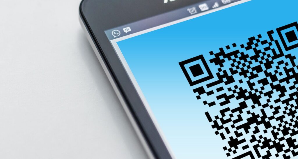 Close-up of a smartphone screen displaying a large QR code