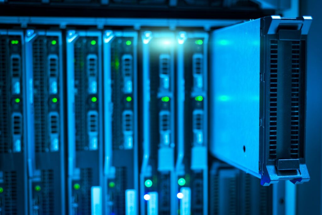 A close view of a blue-lit server rack in a data centre
