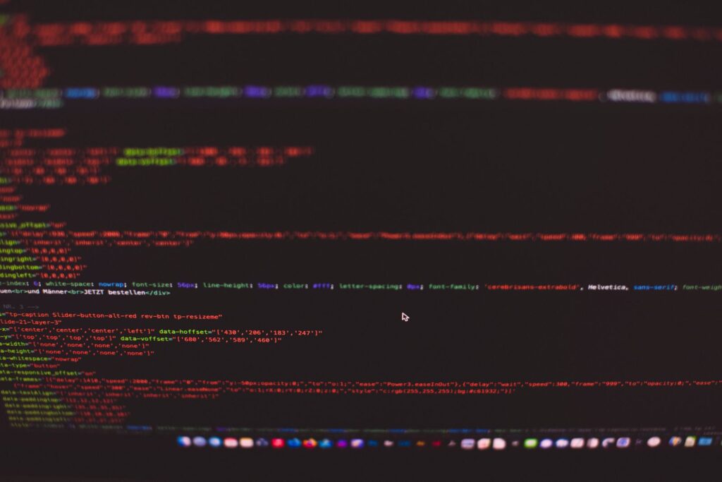 Colourful lines of HTML and CSS code on a dark computer screen